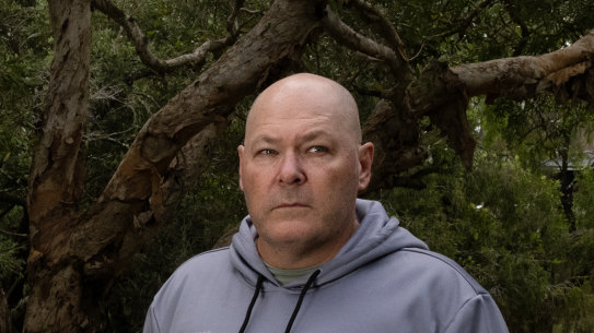 Lismore mayor Steve Krieg standing near a flooded Wilsons River on March 11, 2025.