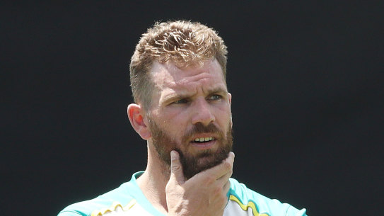 Aaron Finch talks to interim head coach Andrew McDonald during an Australian training session at the Sydney Cricket Ground.