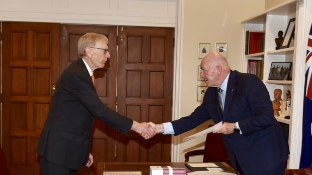Commissioner Kenneth Hayne hands the final report of the banking royal commission to Peter Cosgrove. 