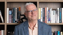 Bronte Capital co-founder and chief investment officer John Hempton in his Bondi Junction office. About half the books on his bookshelf recount frauds.