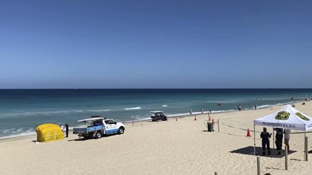 Scarborough Beach was closed after a woman's body was found about 5.30am on Sunday. 
