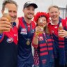 Demons fans charged in WA after illegally entering state for AFL grand final