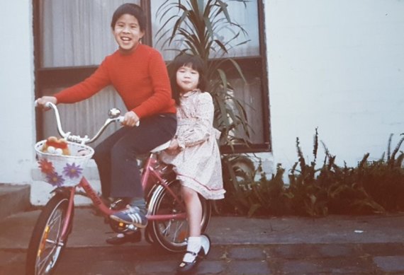 Kelly Eng and her brother as children outside their Glen Waverley home.