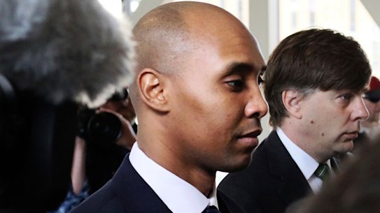 Former Minneapolis police officer Mohamed Noor (centre) is flanked by lawyers Peter Wold and Thomas Plunkett (right) as he enters court on Tuesday. 