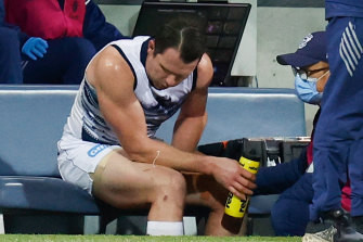 Patrick Dangerfield receives medical treatment.