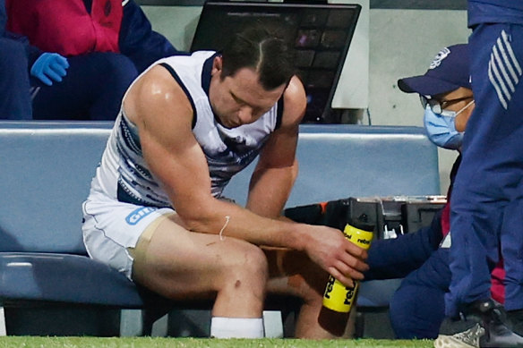 Patrick Dangerfield receives medical treatment.