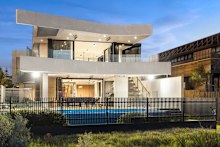 A gate at the home’s rear provides direct access to the beach. 