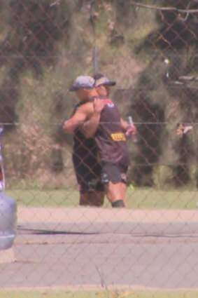 Jarome Luai hugging Scott Sorensen at Panthers training on Saturday.