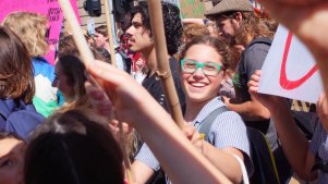 Ella Simons, in the green glasses, at age 12 at the first climate strike in 2018. 