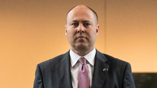 Treasurer Josh Frydenberg arrives on Budget Day at Parliament House in Canberra on October 6. 