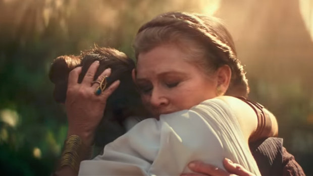 Rey (Daisy Ridley) is embraced by General Leia (Carrie Fisher) in The Rise of Skywalker. 