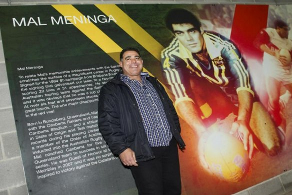Mal Meninga alongside the mural in his honour at St Helens in 2013.