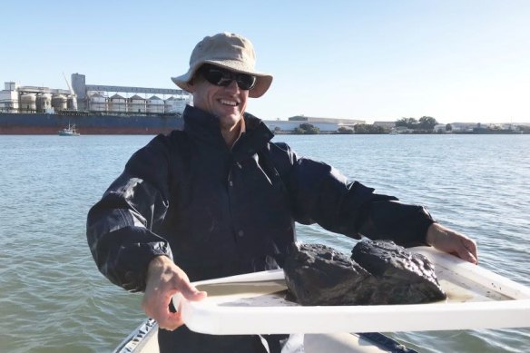 University of Queensland researcher Alistair Grinham says 300 million cubic metres of mud have been washed into Moreton Bay – enough to fill 300 Suncorp stadiums – over the past 50 years.