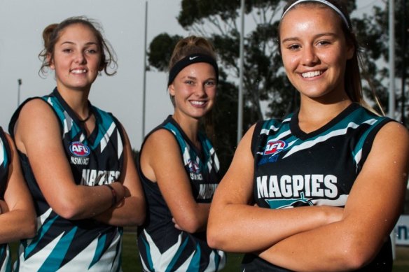 Maggie Gorham (centre), with teammates who qualified for the ACT/NSW Rams squad in 2016, before she gave the game away. 