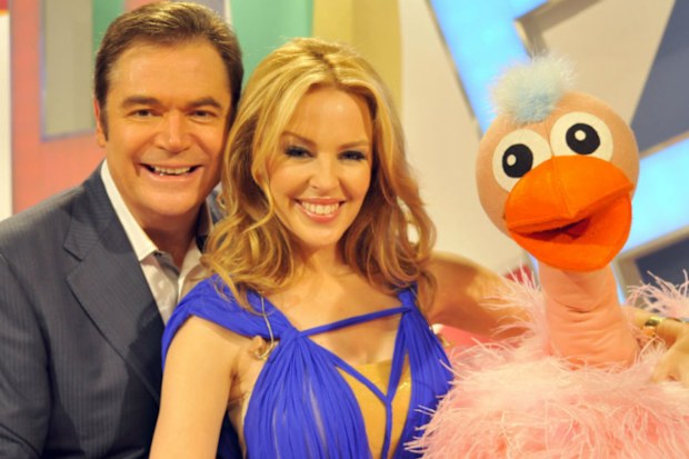 Daryl Somers with Kyle Minogue and Ossie Ostrich during a reunion show in 2010. (AAP)