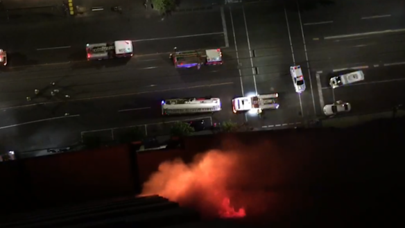 The resident said he could feel the heat in his face as he looked down to see a balcony fully alight on Monday. 