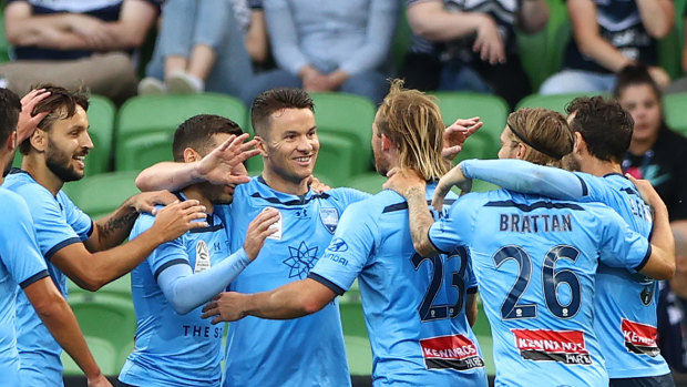 Sky's the limit: Sydney FC players celebrate after Adam Le Fondre put his side on the path to claiming bragging rights in the Big Blue at AAMI Park.