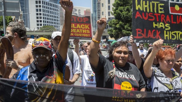 Demonstrators gather to protest the deaths of indigenous Australians in custody.