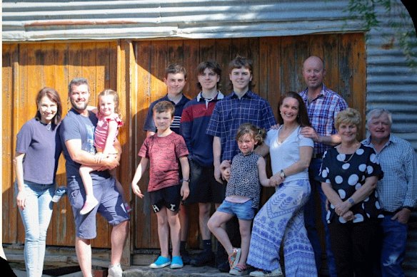 Landowner Jeffrey Barrett (far right), pictured with his son Brett Barrett (second from left) and family, has won $27.9 million in compensation from the state government.