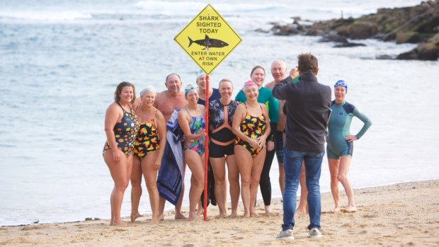 Swimmers brave the waters at Shelly Beach on Saturday.