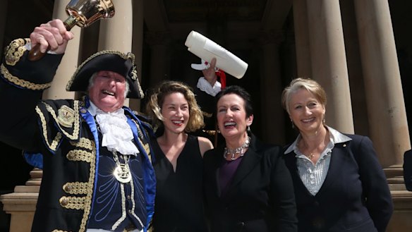 Town crier Graham Keating, Jess Miller, Sydney lord mayor Clover Moore and Professor Kerryn Phelps on the steps of Town Hall at the proclamation of the 2016 council.