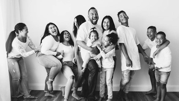 Talatau ‘Junior’ Amone with his family.