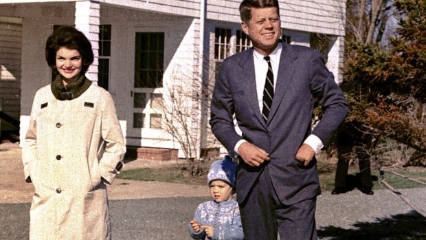 John F. Kennedy takes a stroll with his wife Jacqueline Kennedy and their daughter Caroline at Hyannis Port, Massachusetts in 1960. 