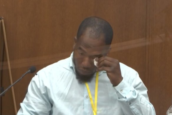 Donald Williams wipes his eyes as he answers questions during the trial of Derek Chauvin.