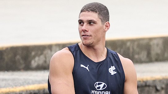 Charlie Curnow watches on from the stands during a Carlton training session at Princes Park last Friday.