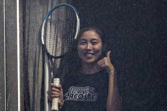 Tennis player Chan Hao-ching (also known as Angel Chan) gives the thumbs up from her hotel quarantine at the View hotel ahead of the Australian Open in Melbourne.
