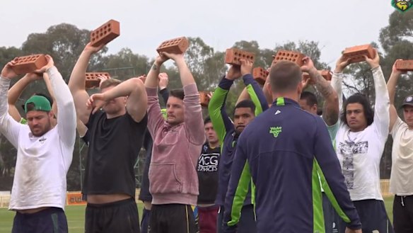 The Raiders carried bricks above their heads at pre-season training this week.