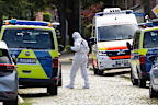 Forensic investigators on a street in Stade, Germany.