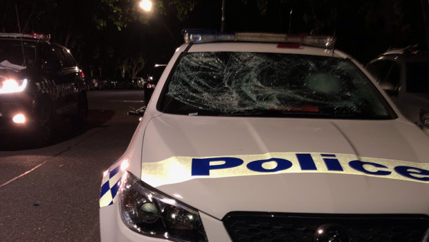 A police car damaged after a rowdy house party in North Melbourne.
