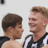 Pies hang on for narrow win over Blues