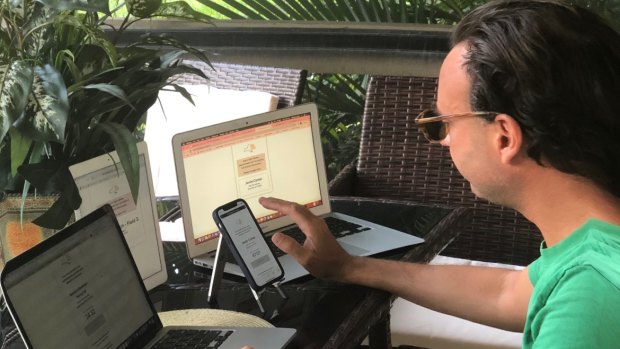 Jason Haber toggles between four screens to secure vaccine appointments. 