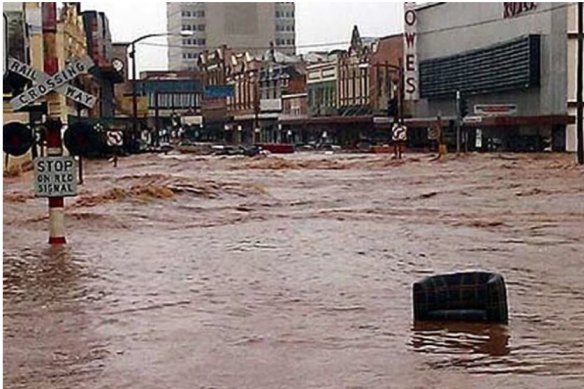 Floodwaters roar through Toowoomba's Russell Street on January 10, 2011.