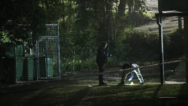 Police examine a crime scene after a 11-year-old girl was sexually assaulted in Newcastle.