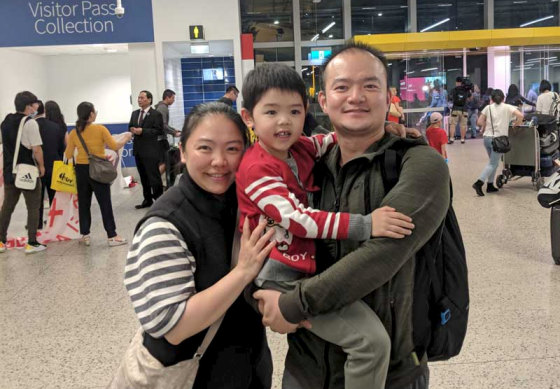 Song Xiao is reunited with his wife and young son at Melbourne Airport after spending time in coronavirus quarantine on Christmas Island.