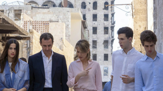 Syrian President Bashar al-Assad and his wife Asma (centre) with their children (from left) Zein, Hafez and Karim outside the Great Mosque of Aleppo in 2022.