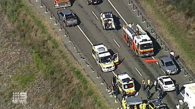 The damaged roadside guardrail and mass of emergency services who raced to the scene.