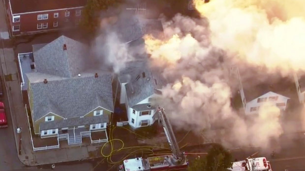 Firefighters battle a large structure fire in Lawrence, Massachusetts, a suburb of Boston. 