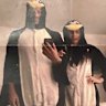 Harry and Meghan in their matching pengion onesies.