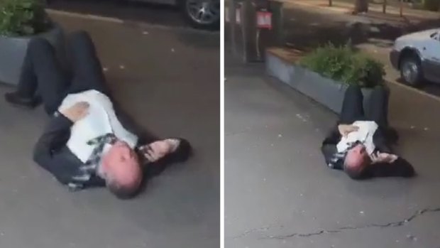 An image from video footage of Barnaby Joyce on the footpath.