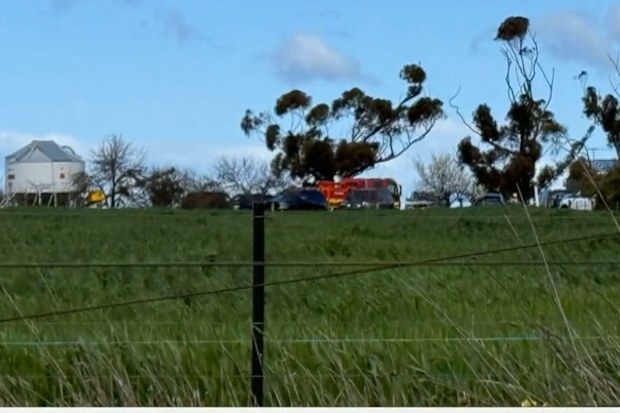 Two children have been rushed to hospital after high winds lifted a jumping castle into the air during a party southwest of Melbourne.