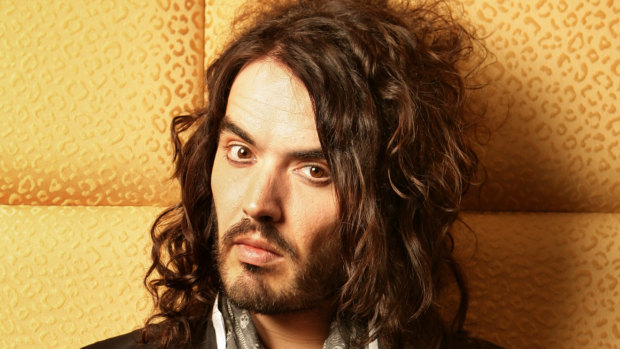Russell Brand didn’t need a mask, he had a persona to hide him in plain sight