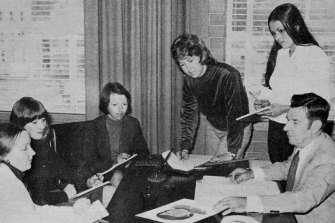 The rape investigation squad in the 1970s looking at a photofit of a wanted offender. Detective Senior Sergeant Murphy is third from the right. 
