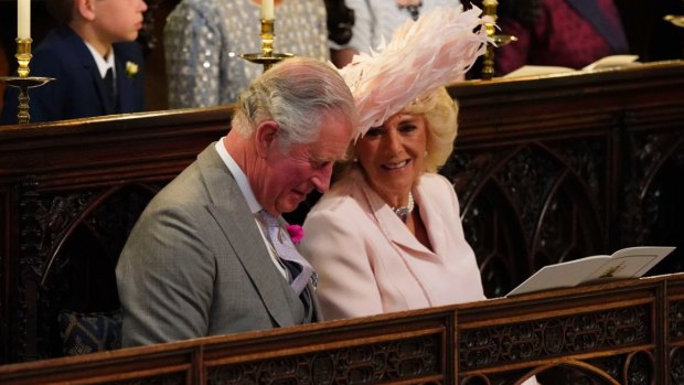 Britain's Prince Charles and Camilla, the Duchess of Cornwall, smile during the wedding ceremony of Prince Harry and Meghan Markle.