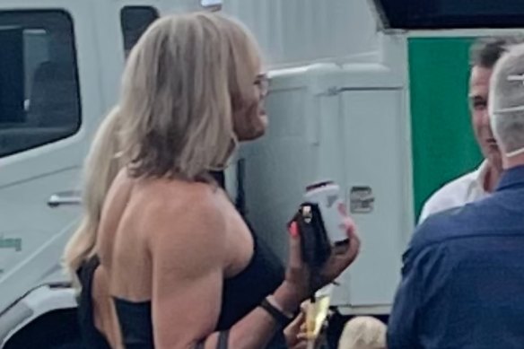 Dani Laidley talking with former North Melbourne captain Anthony Stevens at Geelong Racecourse on Saturday. Ms Laidley gave permission for The Age to publish the image.