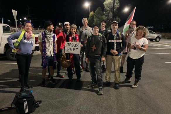 The first official walk by the Gaza Peace Pilgrims (including Rev Alexandra Sangster, holding the ‘Jesus wept’ sign and James Harris, fourth from right) left Melbourne’s  Mernda Railway Station at 4am on Ash Wednesday.