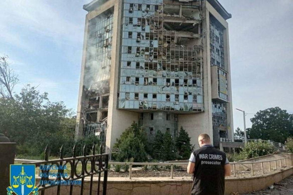 An inspector surveys the damage at a grain port facility after a reported attack by Russian military drones in the Odesa region this week.